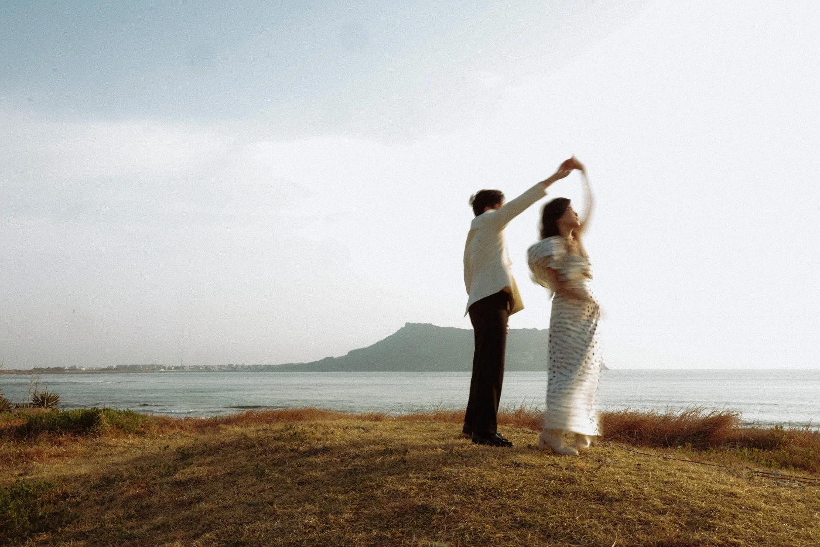 Vũ and Thi dancing on the Jeju coast